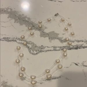 Floating pearl necklace
